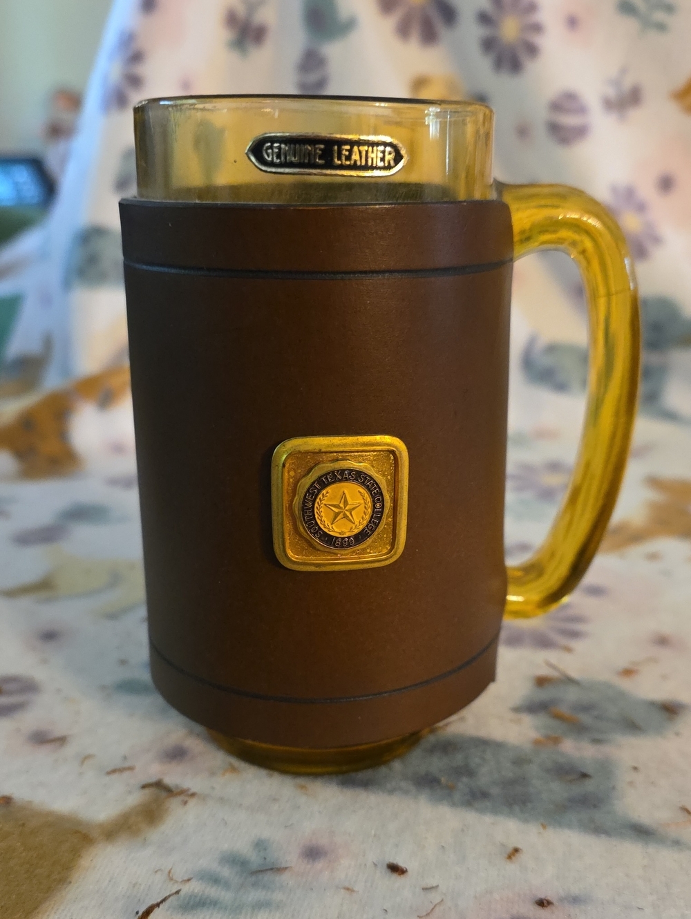 Vintage amber glass beer mug featuring a fitted brown leather wrap